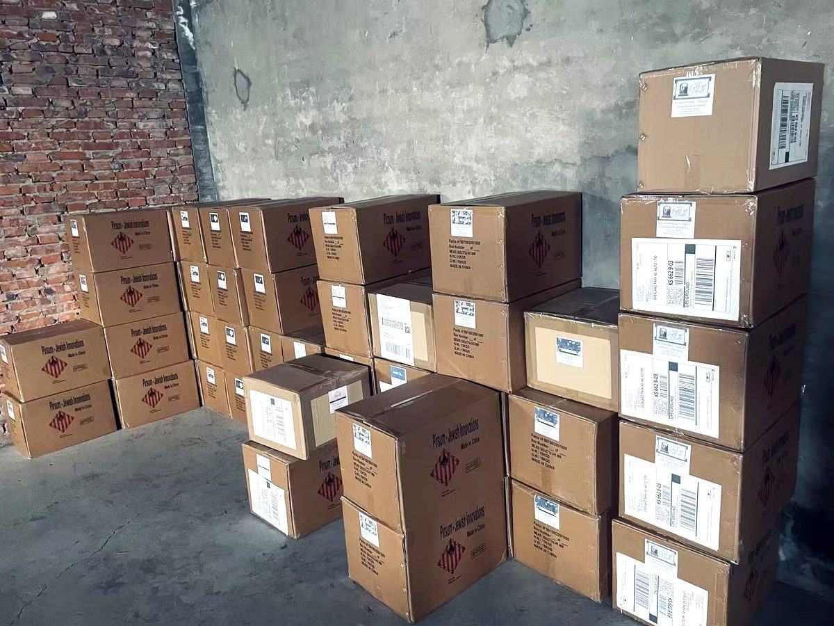 Export cartons of matchboxes stacked in the warehouse, barcode-labelled and ready for container loading